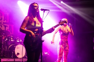 Ines Erbus performing with band at local student party.